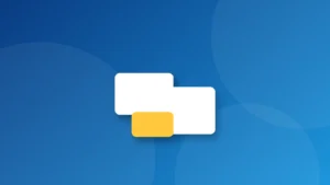 Ảnh bìa minh họa: biểu tượng Windows trên nền laptop có bàn di chuột